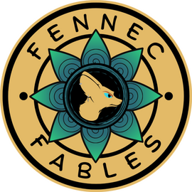 The fennec fables logo a stylized fennec fox head in an inky pool of black that has rings of styalized raindrops in a flower like shape encirled in yellow with Fennec on the upper part and Fables on the lower